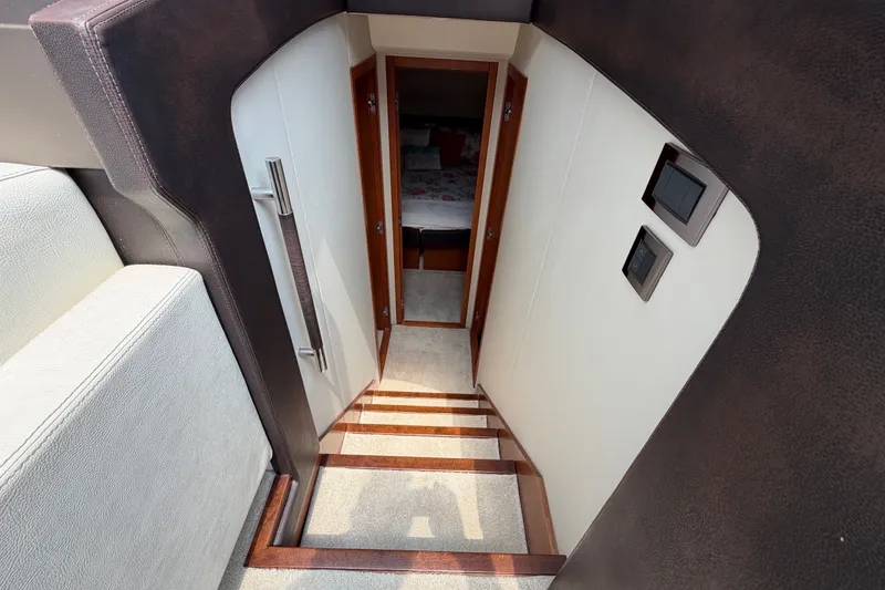 Slide: The Image of Stairway leading to cabin interior of 2012 Prestige 500S yacht. - 27