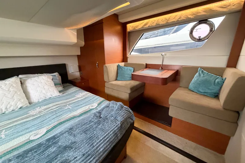 Slide: The Image of Luxurious 2012 Prestige 500S yacht interior with cozy bed and seating area. - 66