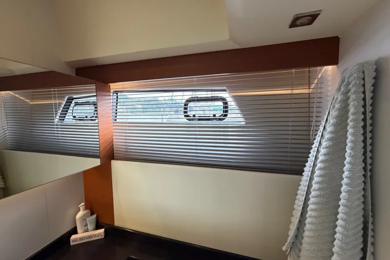 Slide: The Image of Interior of 2012 Prestige 500S yacht bathroom with window blinds and mirror reflection. - 60