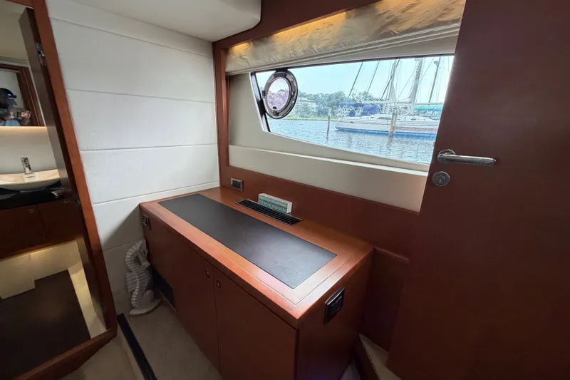 Slide: The Image of Interior of a 2012 Prestige 500S yacht with a window view of a marina. - 53