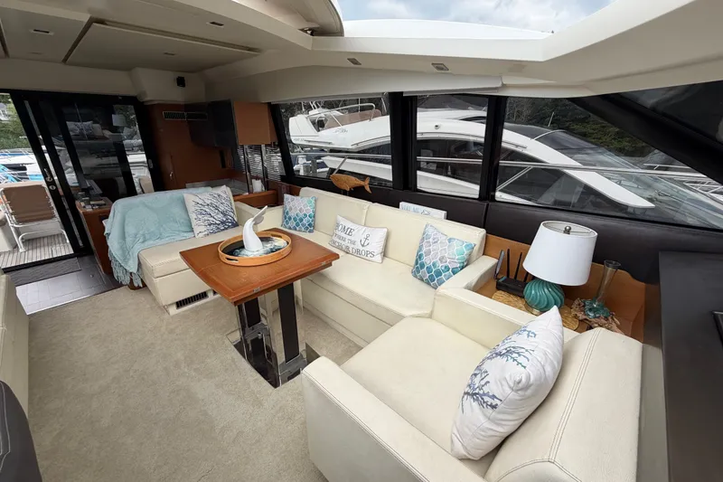 Slide: The Image of Luxurious interior of a 2012 Prestige 500S yacht with elegant seating and decor. - 44