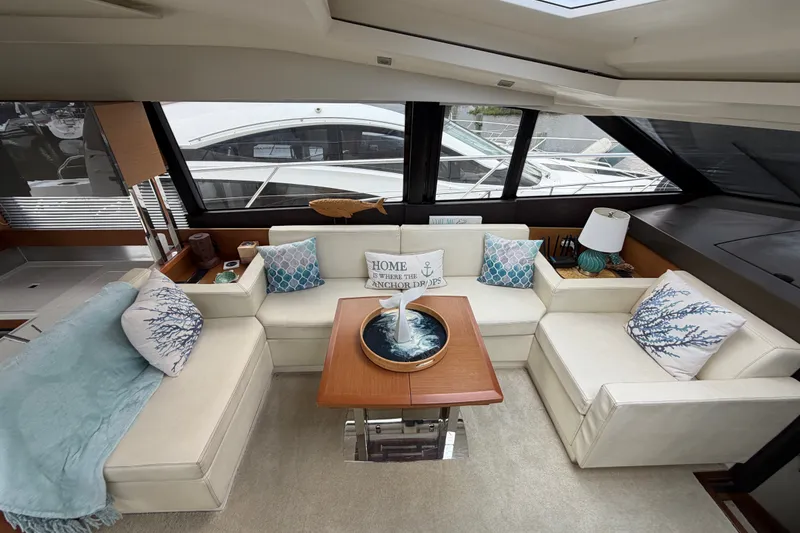 Slide: The Image of Luxurious interior of a 2012 Prestige 500S yacht with elegant seating and nautical decor. - 17