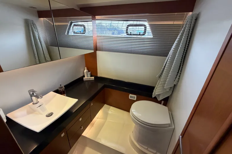 Slide: The Image of Luxurious bathroom in a 2012 Prestige 500S yacht, featuring modern fixtures and elegant design. - 58
