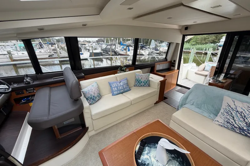 Slide: The Image of Luxurious interior of a 2012 Prestige 500S yacht with marina view. - 19