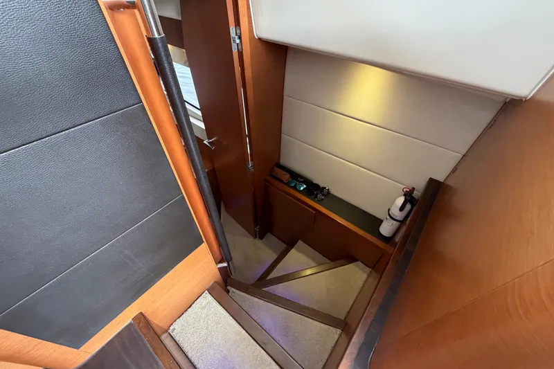 Slide: The Image of Interior staircase of 2012 Prestige 500S yacht with wooden finish and safety equipment. - 50