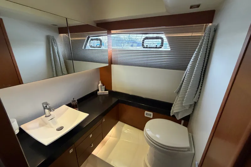 Slide: The Image of Luxurious bathroom interior of a 2012 Prestige 500S yacht, featuring modern fixtures and elegant design. - 63