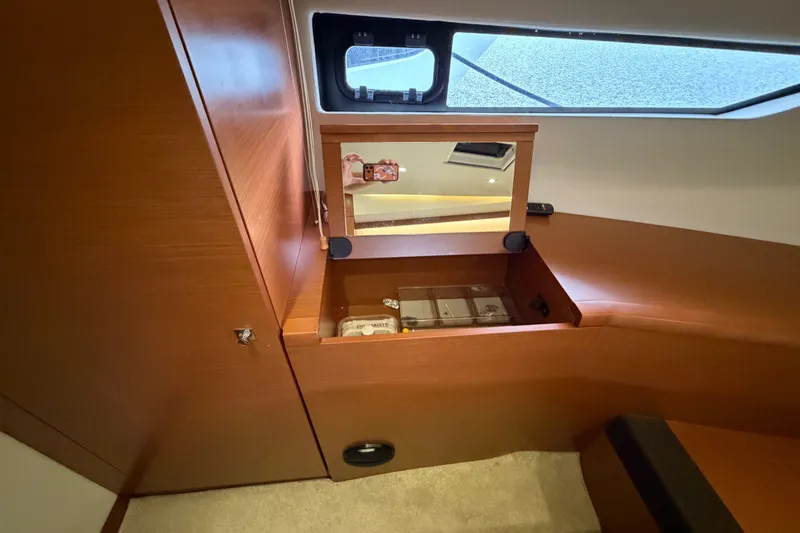 Slide: The Image of Luxurious interior of 2012 Prestige 500S yacht with wooden cabinetry and mirror. - 74