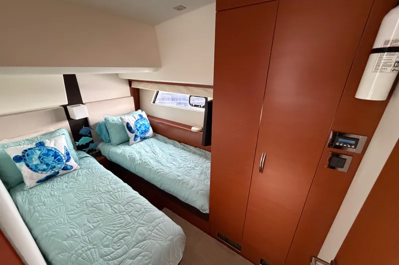 Slide: The Image of Luxurious twin cabin in 2012 Prestige 500S yacht with sea turtle decor. - 38