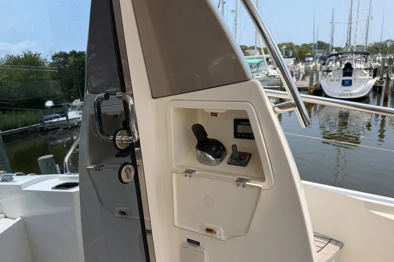 Slide: The Image of 2012 Prestige 500S yacht helm station with control panel at marina. - 9