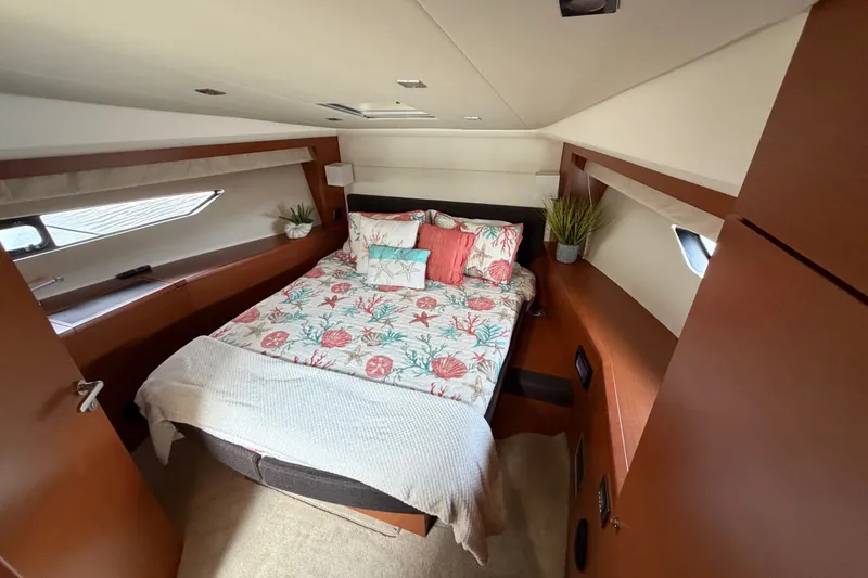 Slide: The Image of Luxurious cabin interior of 2012 Prestige 500S yacht with cozy bed and elegant decor. - 29