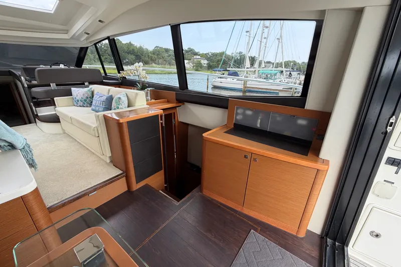 Slide: The Image of Luxurious interior of 2012 Prestige 500S yacht with elegant seating and scenic window view. - 13
