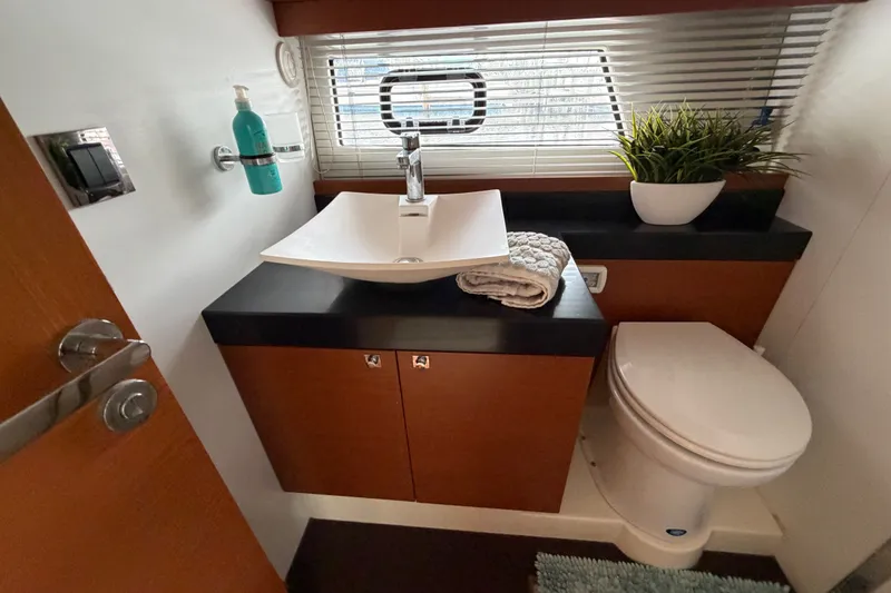 Slide: The Image of Luxurious bathroom in a 2012 Prestige 500S yacht with modern sink and toilet. - 33