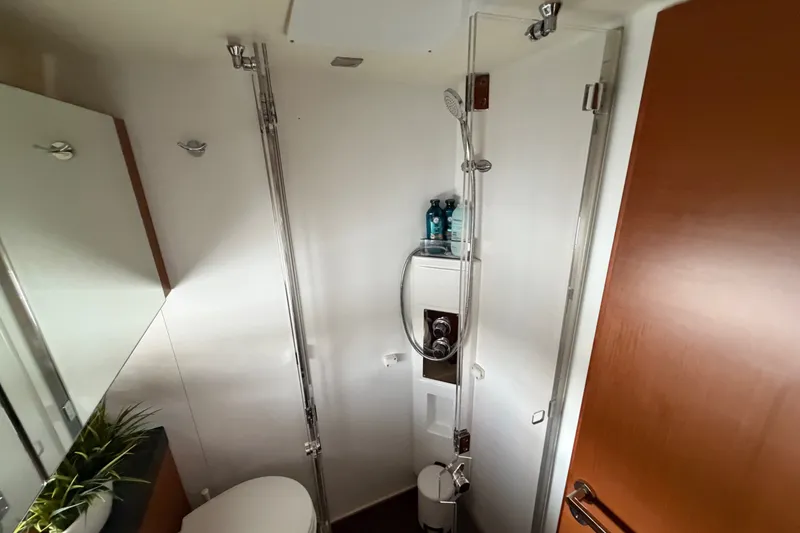 Slide: The Image of Bathroom interior of a 2012 Prestige 500S yacht, featuring a shower and modern fixtures. - 36