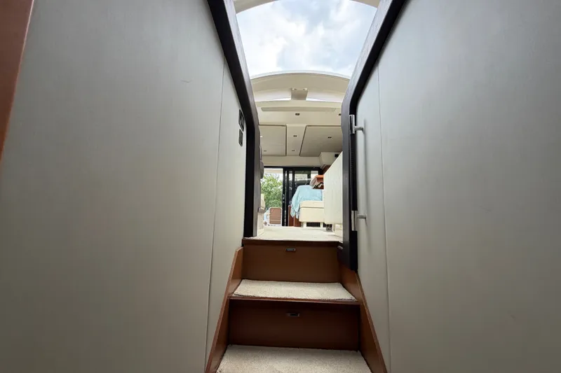Slide: The Image of Interior view of 2012 Prestige 500S yacht, showcasing stairs leading to the cabin area. - 42