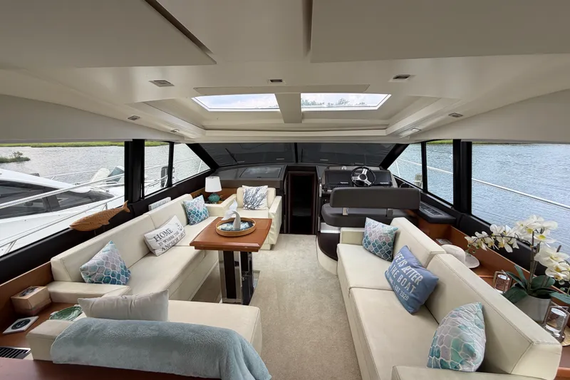 Slide: The Image of Luxurious interior of a 2012 Prestige 500S yacht with elegant seating and decor. - 16