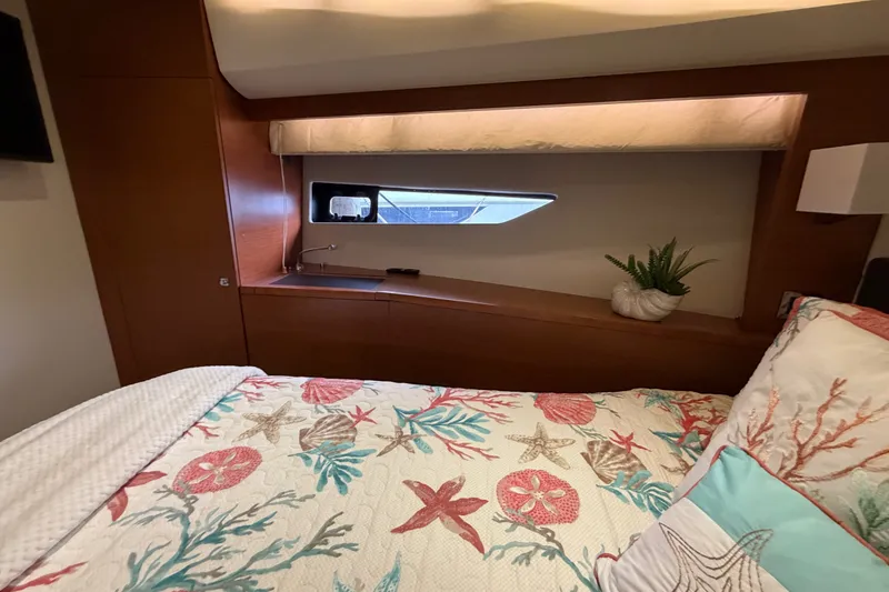 Slide: The Image of Luxurious cabin interior of 2012 Prestige 500S yacht with nautical-themed bedding. - 71