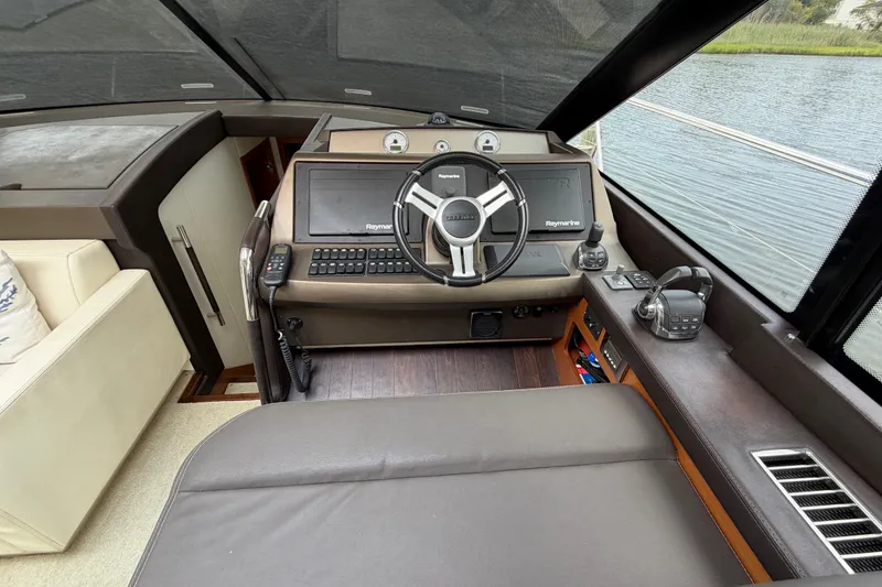 Slide: The Image of Prestige 500S 2012 yacht helm with Raymarine navigation system and luxurious interior. - 21