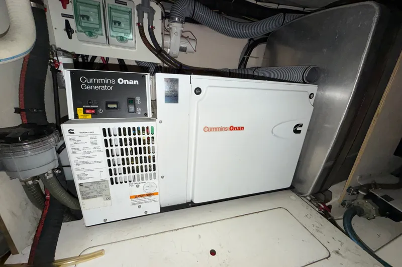 Slide: The Image of Cummins Onan generator in a 2012 Prestige 500S yacht engine room. - 95