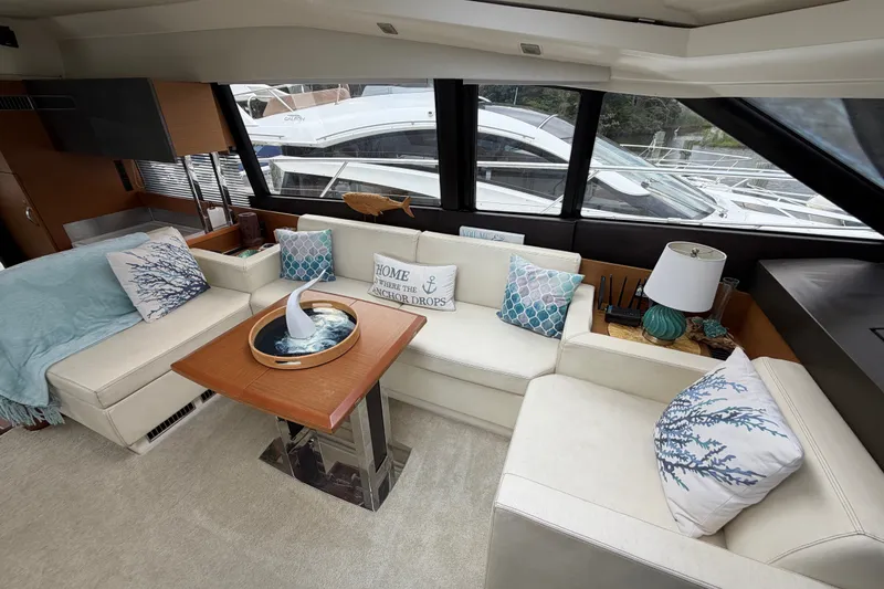 Slide: The Image of Luxurious interior of a 2012 Prestige 500S yacht with elegant seating and nautical decor. - 18
