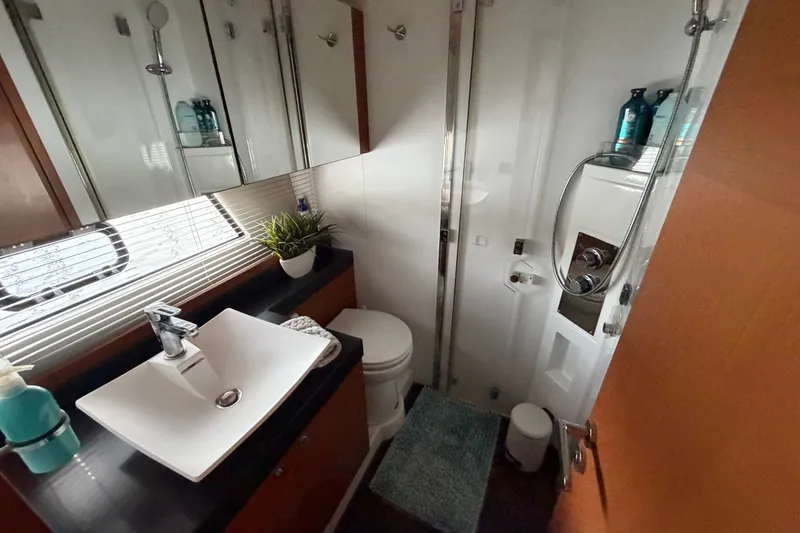 Slide: The Image of Luxurious bathroom in a 2012 Prestige 500S yacht, featuring modern fixtures and elegant design. - 32