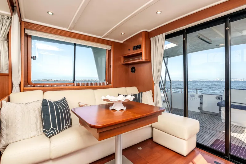 Slide: The Image of Interior of 2019 Beneteau Swift Trawler 44 with ocean view through large windows. - 17