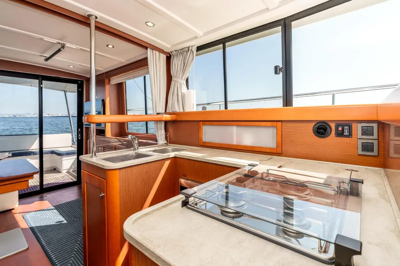 Slide: The Image of Interior of 2019 Beneteau Swift Trawler 44, featuring modern kitchen and ocean view. - 22