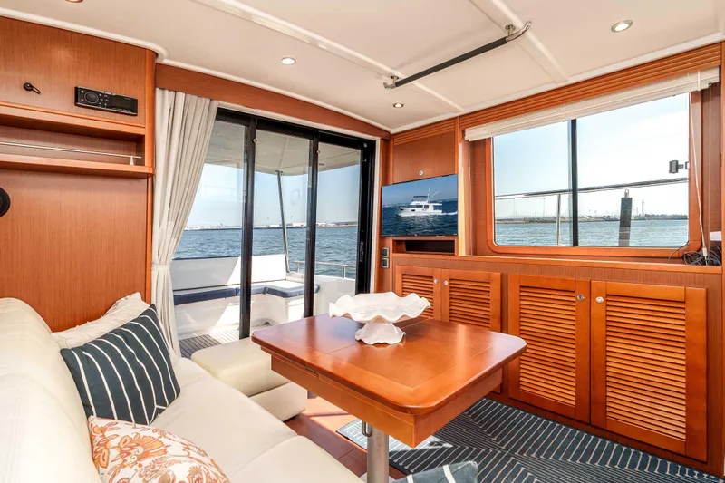 Slide: The Image of Luxurious interior of 2019 Beneteau Swift Trawler 44 with ocean view and elegant furnishings. - 18
