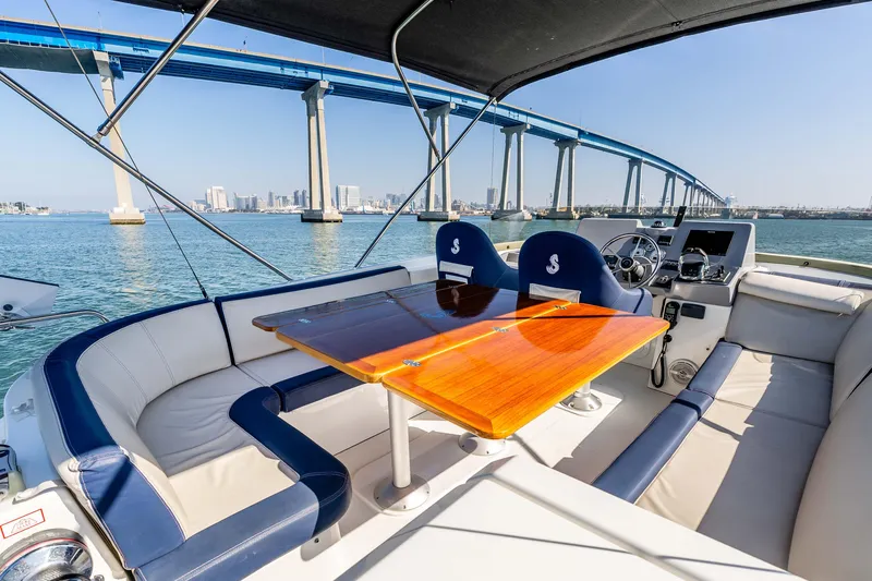 Slide: The Image of 2019 Beneteau Swift Trawler 44 interior with bridge view, featuring elegant seating and helm. - 13