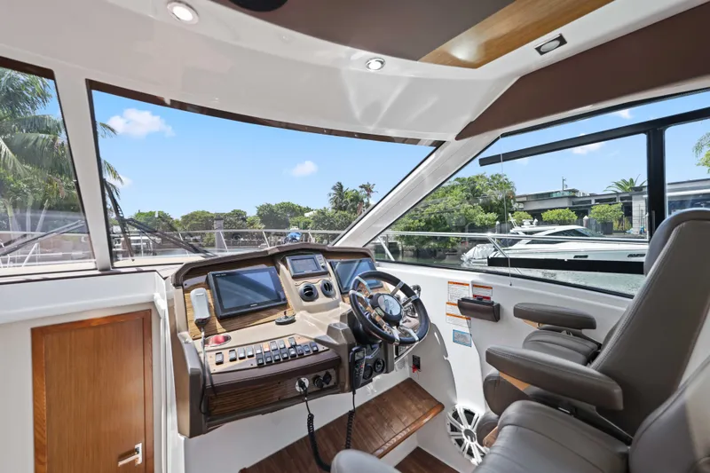 Slide: The Image of Helm of 2016 Cruisers Yachts 45 Cantius with modern controls and panoramic view. - 40