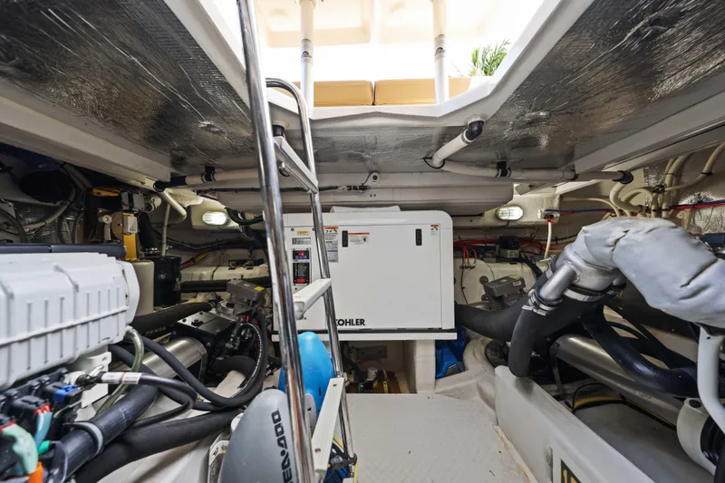 Slide: The Image of Engine room of 2016 Cruisers Yachts 45 Cantius, featuring Kohler generator and mechanical systems. - 62