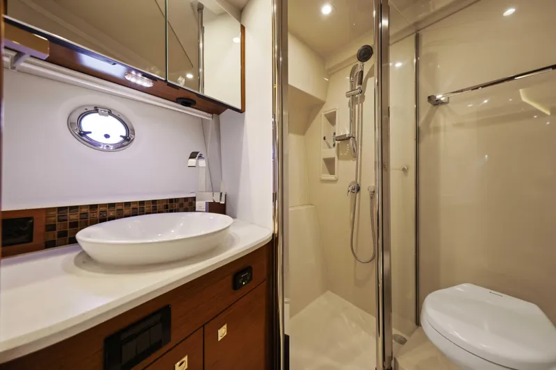 Slide: The Image of Luxurious bathroom in 2016 Cruisers Yachts 45 Cantius with modern fixtures and shower. - 47