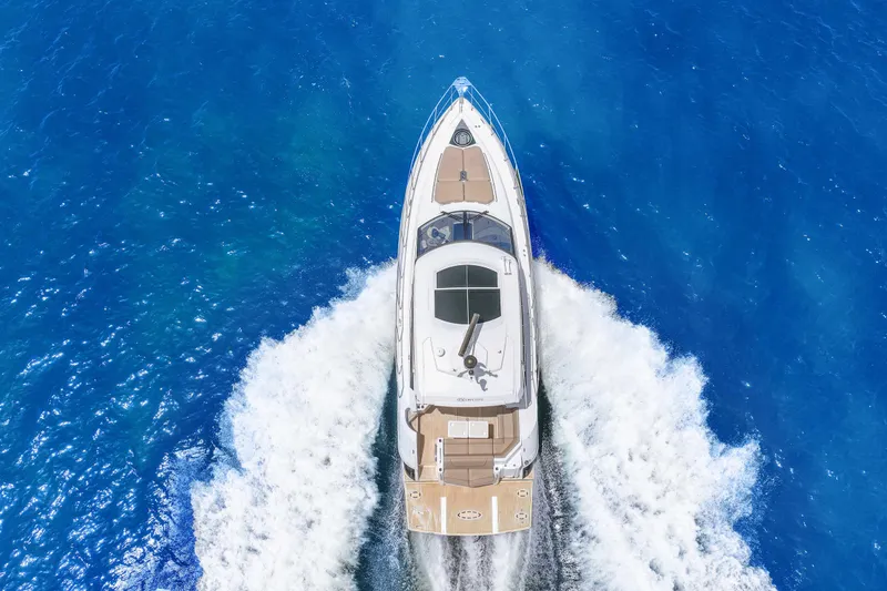 Slide: The Image of 2016 Cruisers Yachts 45 Cantius cruising on vibrant blue ocean waters. - 6