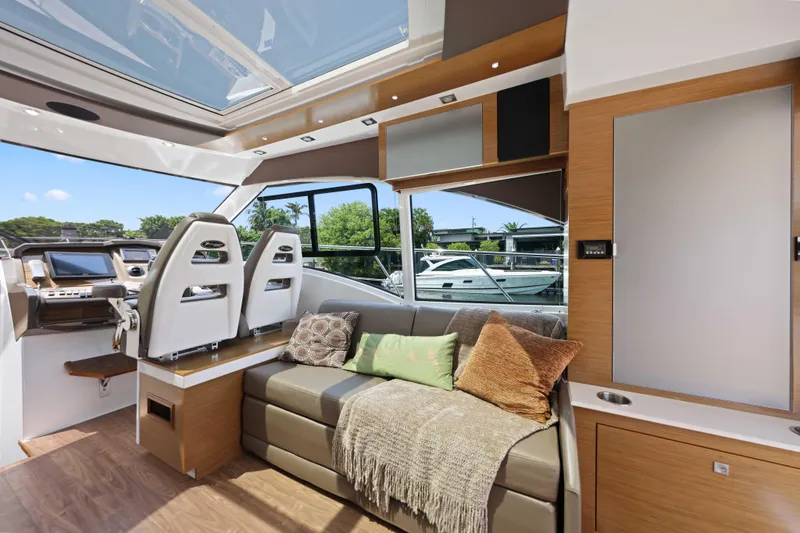 Slide: The Image of Luxurious interior of 2016 Cruisers Yachts 45 Cantius with plush seating and modern helm. - 38