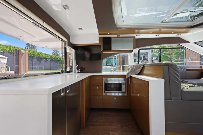 Slide: The Image of Luxurious interior of 2016 Cruisers Yachts 45 Cantius with modern kitchen and seating area. - 33