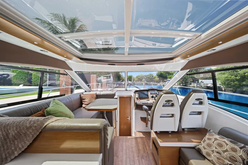 Slide: The Image of Luxurious interior of 2016 Cruisers Yachts 45 Cantius with panoramic windows and modern seating. - 35
