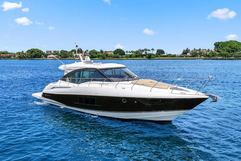 The Image of 2016 Cruisers Yachts 45 Cantius cruising on a sunny day, surrounded by blue water. - 0