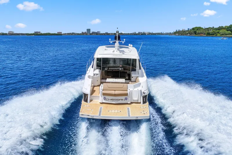 Slide: The Image of 2016 Cruisers Yachts 45 Cantius cruising on open blue water, rear view. - 8