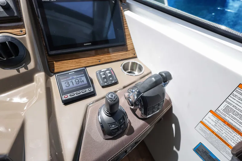Slide: The Image of Control panel of 2016 Cruisers Yachts 45 Cantius with Garmin display and throttle controls. - 44