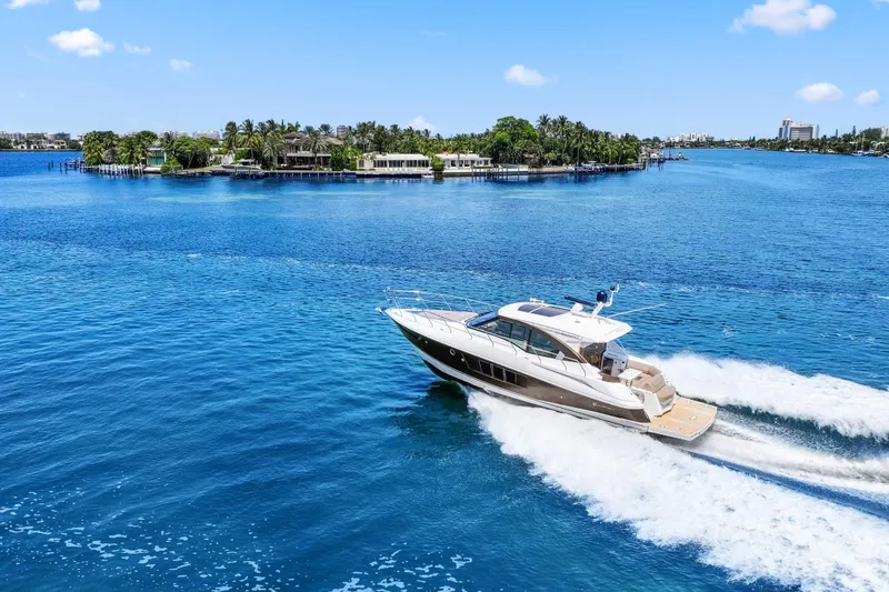 Slide: The Image of 2016 Cruisers Yachts 45 Cantius cruising on blue waters near a tropical island. - 5