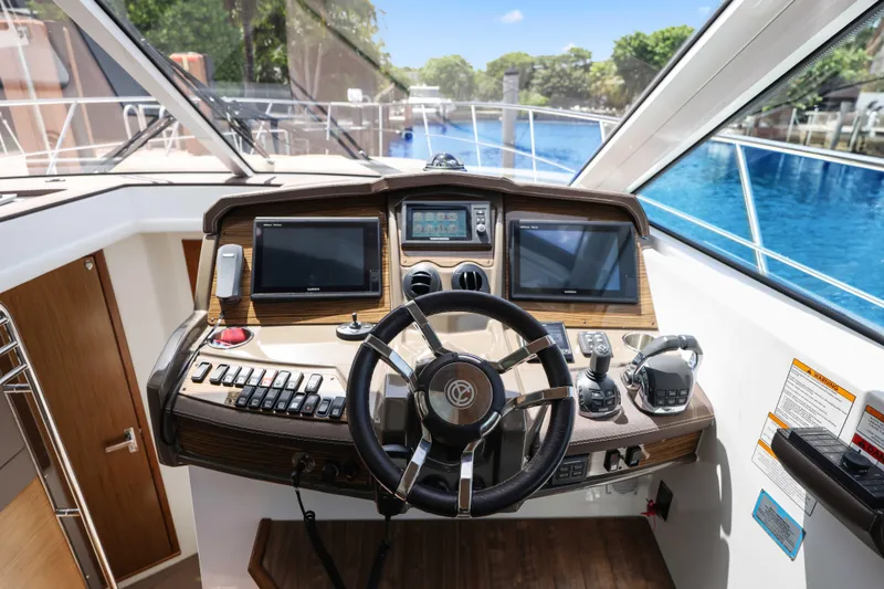 Slide: The Image of Helm of 2016 Cruisers Yachts 45 Cantius with modern navigation equipment and controls. - 42