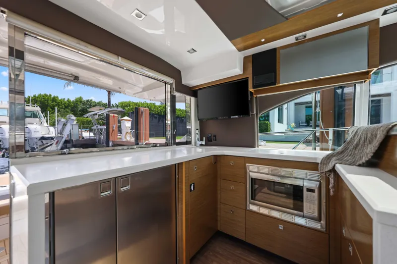 Slide: The Image of Luxurious interior of 2016 Cruisers Yachts 45 Cantius with modern kitchen amenities. - 32