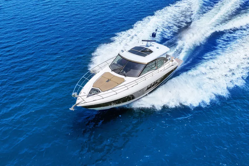 Slide: The Image of 2016 Cruisers Yachts 45 Cantius cruising on vibrant blue ocean waters. - 9