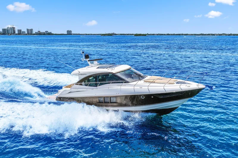 Slide: The Image of 2016 Cruisers Yachts 45 Cantius cruising on vibrant blue ocean waters. - 13