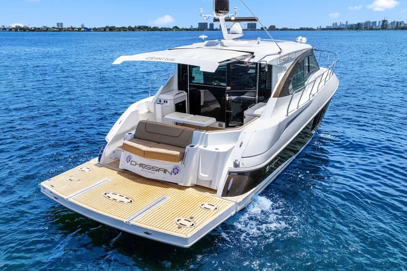 Slide: The Image of 2016 Cruisers Yachts 45 Cantius on open water, showcasing sleek design and luxury features. - 16
