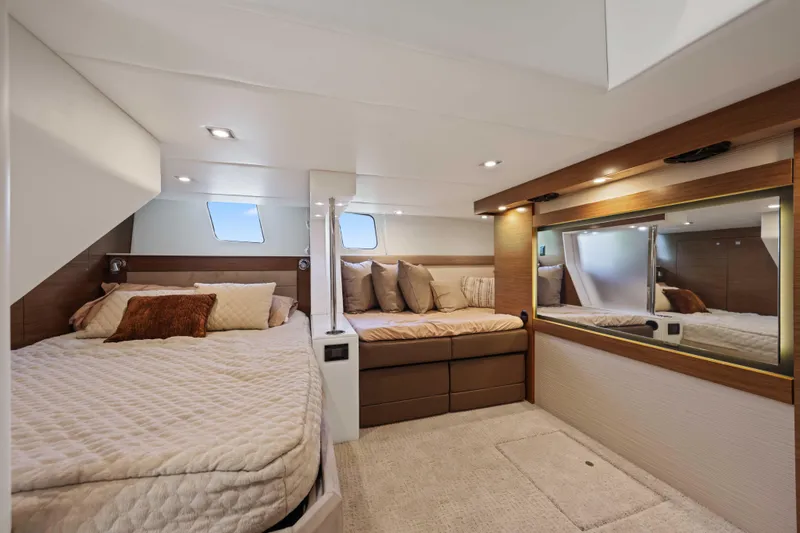 Slide: The Image of Luxurious 2016 Cruisers Yachts 45 Cantius cabin with cozy bedding and elegant decor. - 50