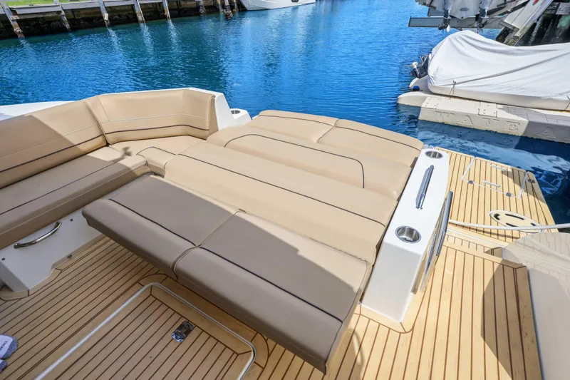 Slide: The Image of Luxurious 2016 Cruisers Yachts 45 Cantius with spacious deck seating by the water. - 23