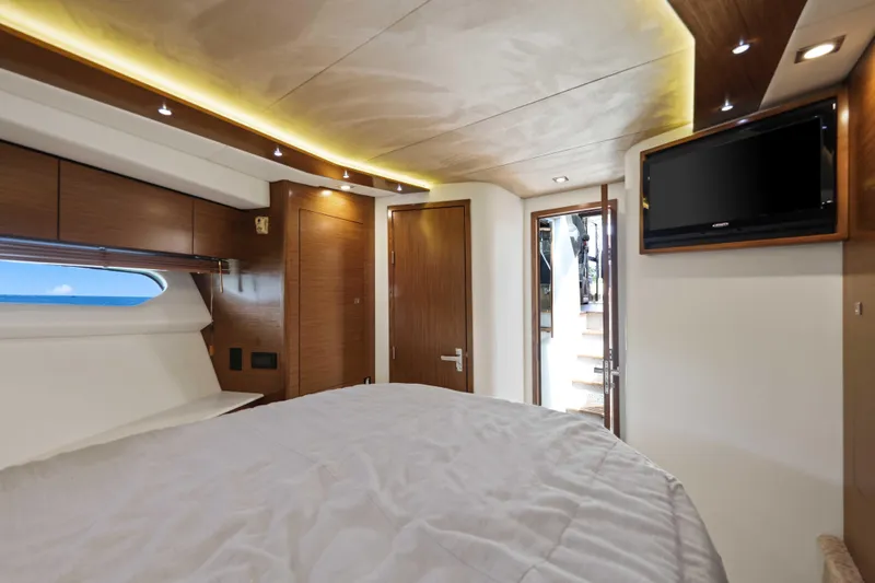 Slide: The Image of Luxurious interior of 2016 Cruisers Yachts 45 Cantius with modern wood finishes and cozy bedding. - 46