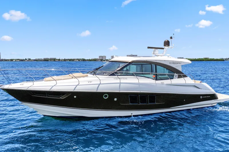 Slide: The Image of 2016 Cruisers Yachts 45 Cantius on blue ocean, sleek design, sunny day. - 1