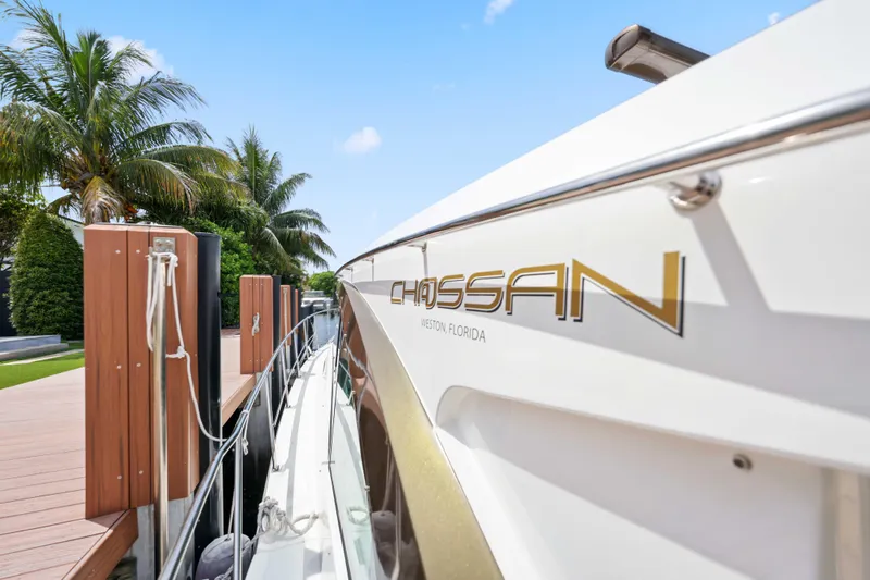 Slide: The Image of 2016 Cruisers Yachts 45 Cantius docked, palm trees in background, sunny day. - 58