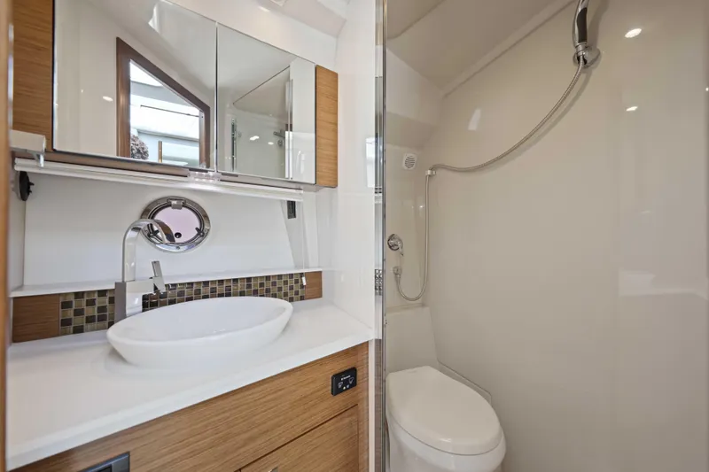 Slide: The Image of Luxurious bathroom in 2016 Cruisers Yachts 45 Cantius, featuring modern fixtures and elegant design. - 56